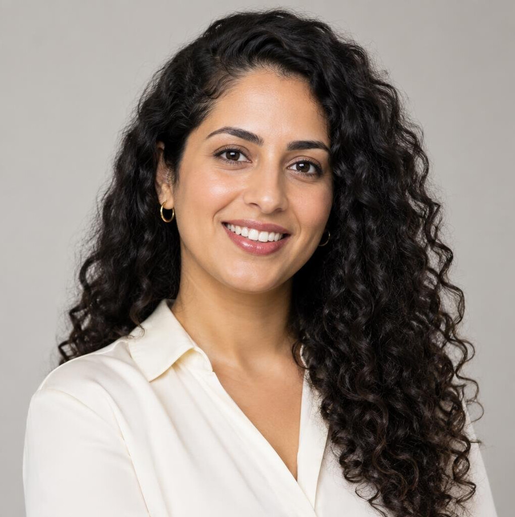 Portrait of a young woman with curly hair smiling