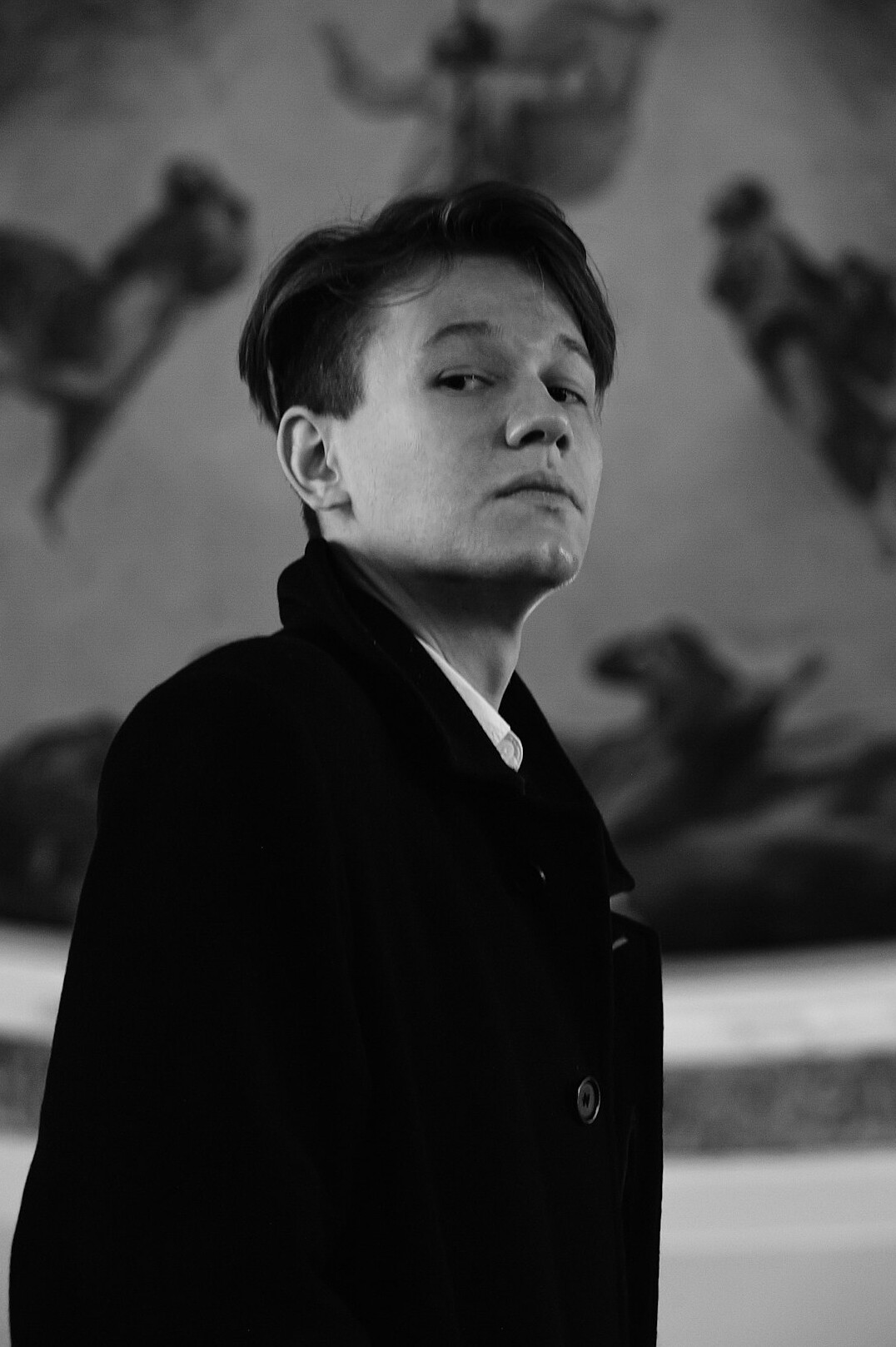 Portrait of a man in a dark suit with short hair
